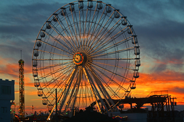 Abandoned Wonderland Pier Ferris wheel above a crumbling Ocean City, New Jersey, boardwalk.