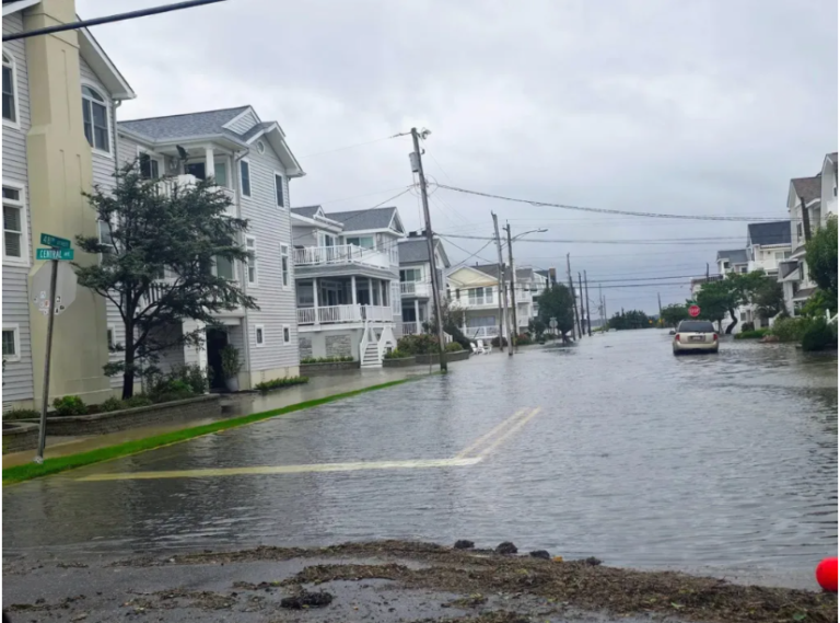 Ocean City NJ Street Flooded street in Ocean City, New Jersey, illustrating coastal flooding concerns associated with Ocean City beach replenishment and storm protection.